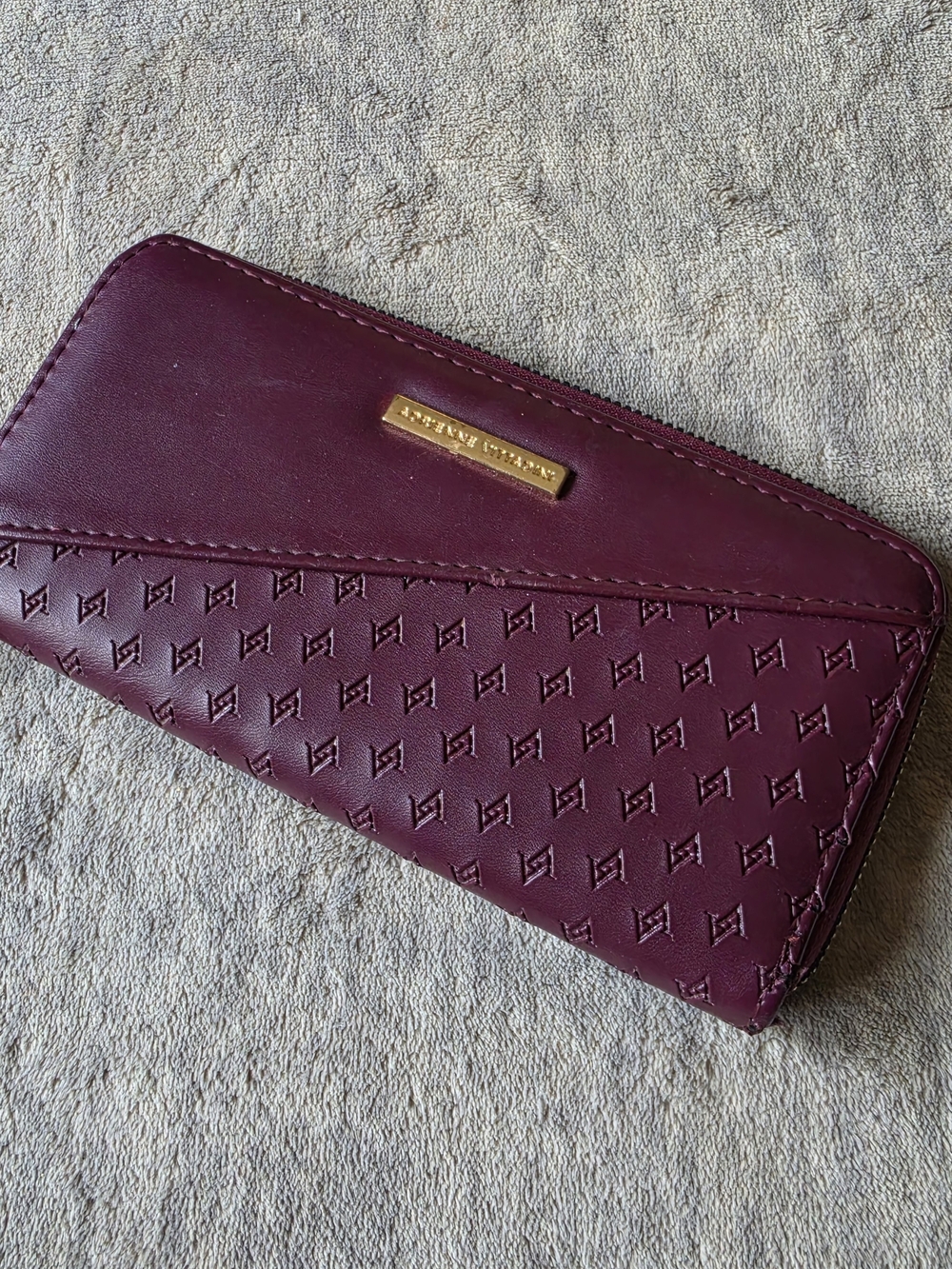 Adrienne Vittadini Plum Zip Around Wallet with Embossed Logo